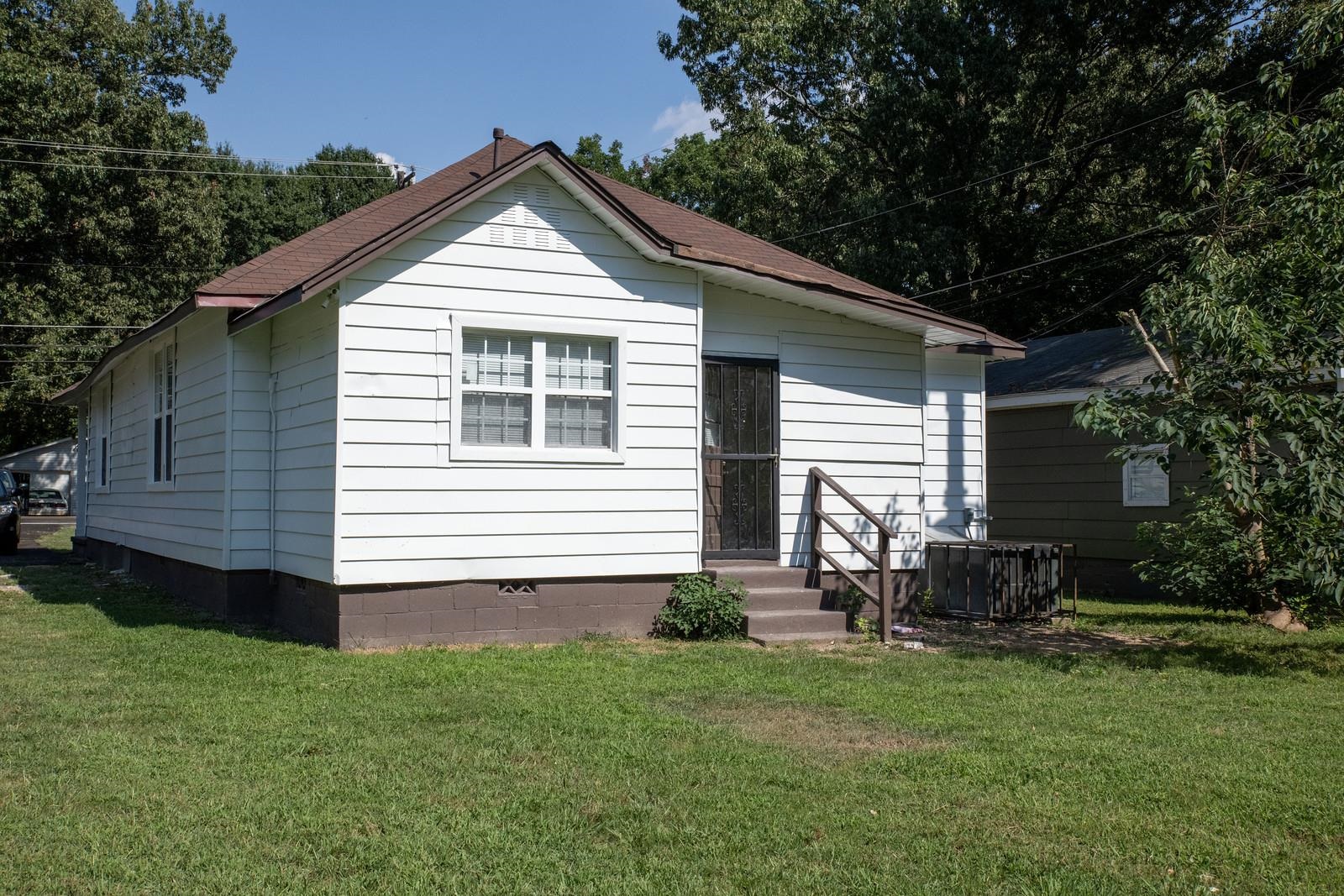 4103 Orleans Road Memphis, TN 38116 - Photo 28 of 32 a view of a house with a yard plants and large tree