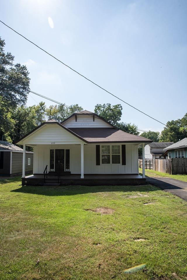 4103 Orleans Road Memphis, TN 38116 - Photo 29 of 32 a front view of a house with a yard table and chairs