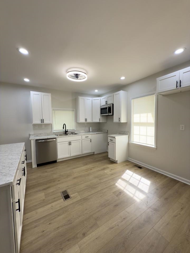 4103 Orleans Road Memphis, TN 38116 - Photo 5 of 32 a view of a kitchen with a sink cabinets and a window