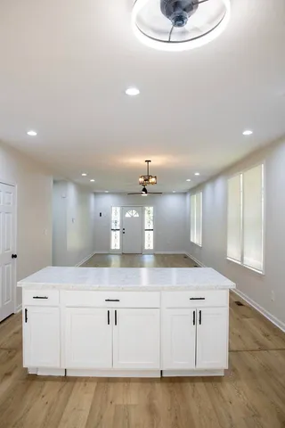 a view of a swimming pool with an outdoor space and seating area