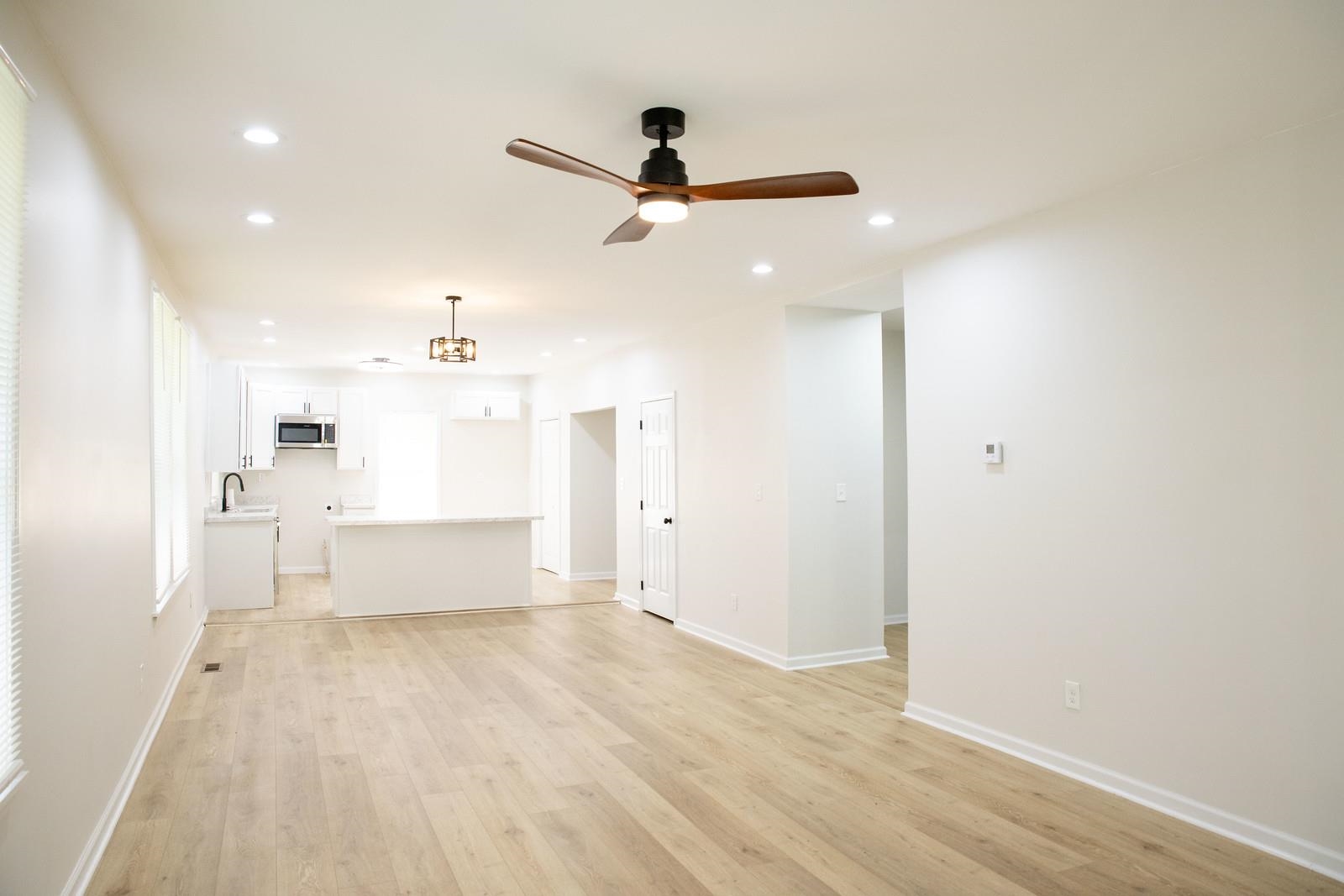 4103 Orleans Road Memphis, TN 38116 - Photo 6 of 32 a view of a kitchen with wooden floor a sink and windows
