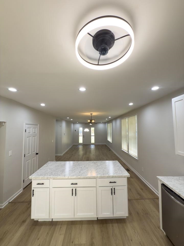 4103 Orleans Road Memphis, TN 38116 - Photo 31 of 32 a kitchen with kitchen island a stove and a sink