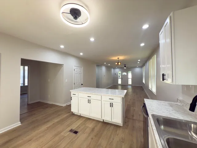 a front view of a house with a yard table and chairs