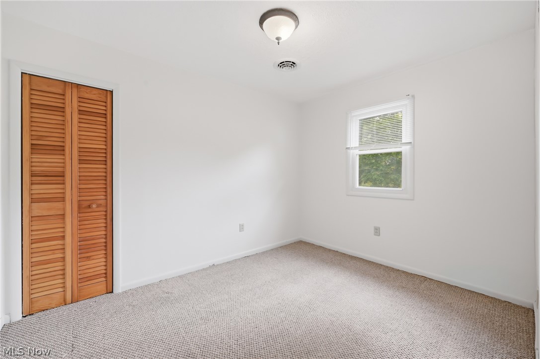 4570 Pymatuning Lake Road Andover, OH 44003 - Photo 20 of 38 Neutral-toned carpeting complements bright white walls