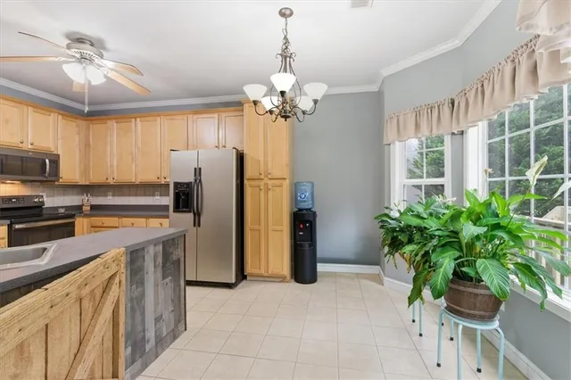 a dining room with a table and chairs