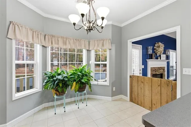 a living room with fireplace furniture and a table