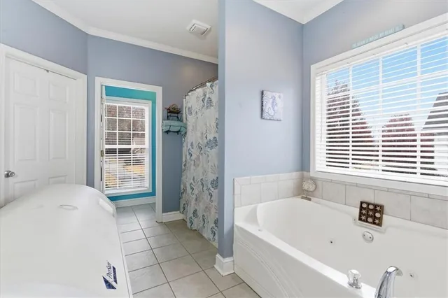 a bedroom with furniture and a flat screen tv