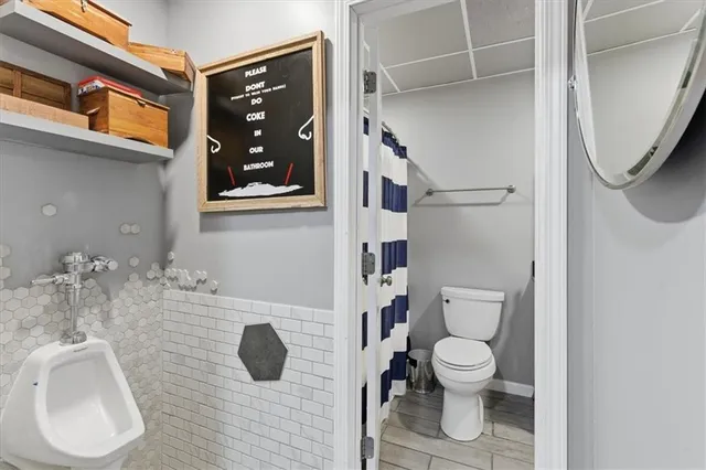 a bathroom with a toilet and a sink