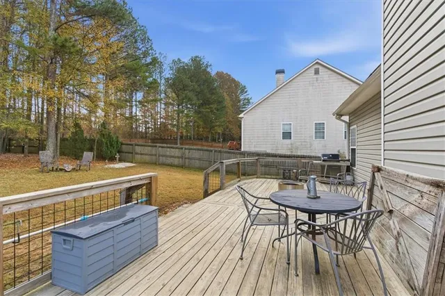 a house view with a swimming pool and sitting space