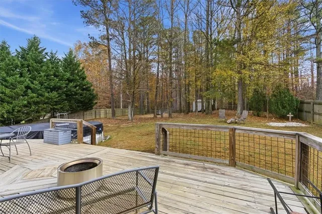 a tall wooden building with trees in front of it