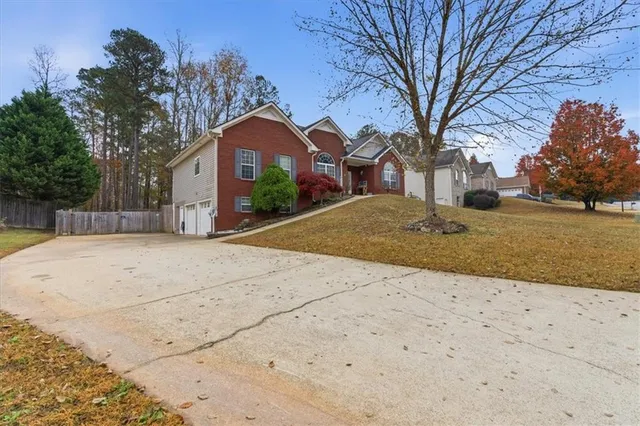 a front view of a house with a yard