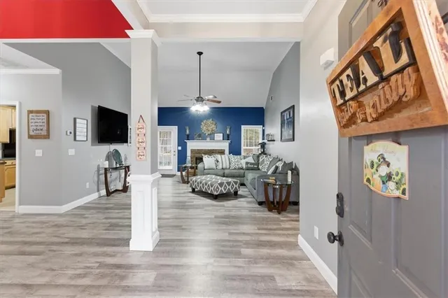 a living room with furniture and a flat screen tv