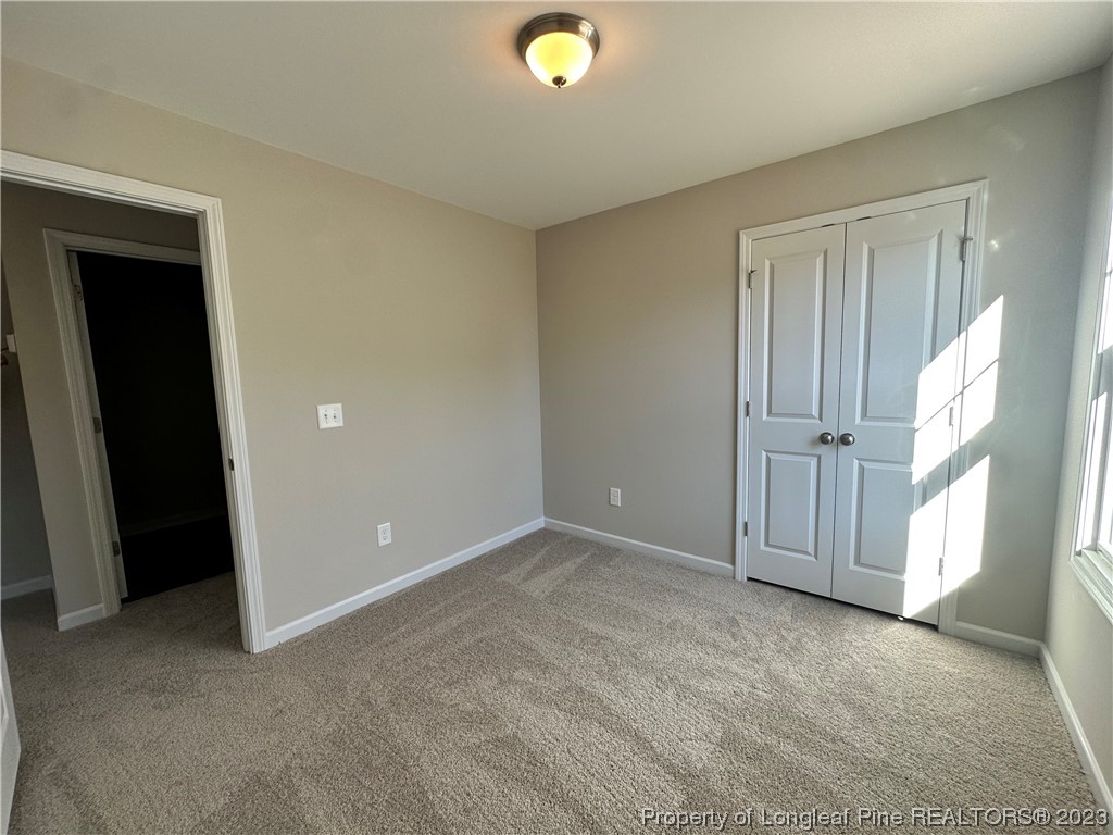 757 Britt Road St. Pauls, NC 28384 - Photo 14 of 25 an empty room with windows and closet