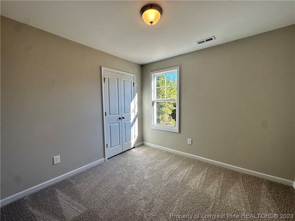 757 Britt Road St. Pauls, NC 28384 - Photo 15 of 25 an empty room with windows and closet