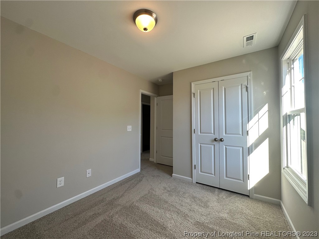 757 Britt Road St. Pauls, NC 28384 - Photo 16 of 25 an empty room with windows and closet