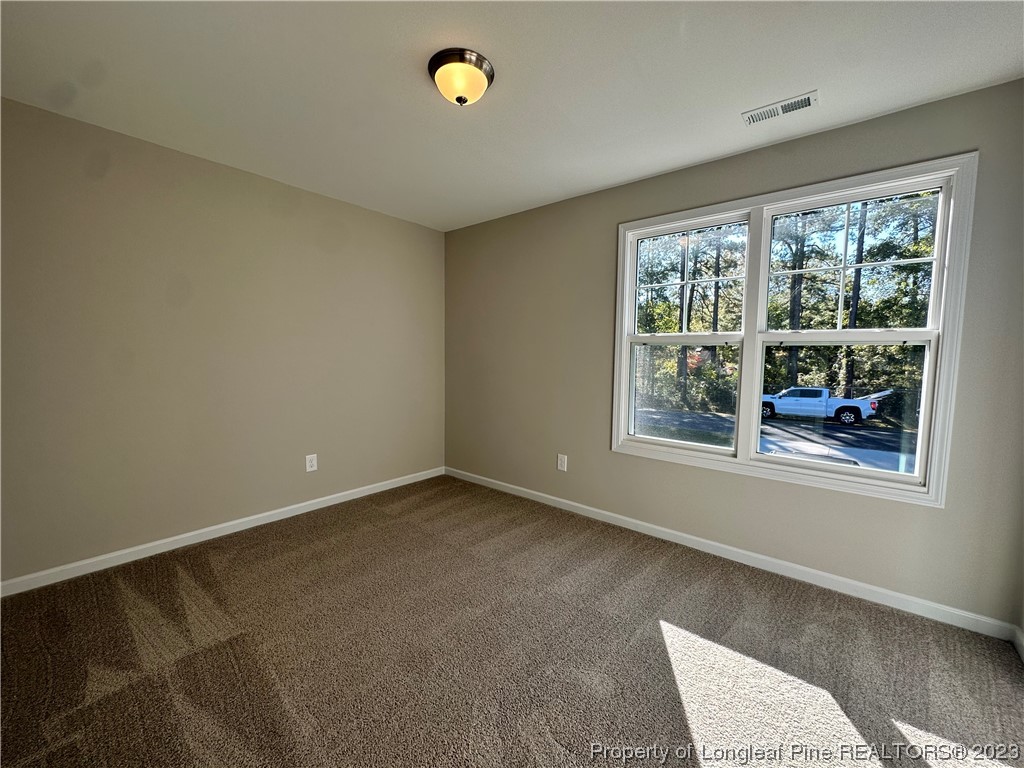 757 Britt Road St. Pauls, NC 28384 - Photo 21 of 25 a view of an empty room with a window