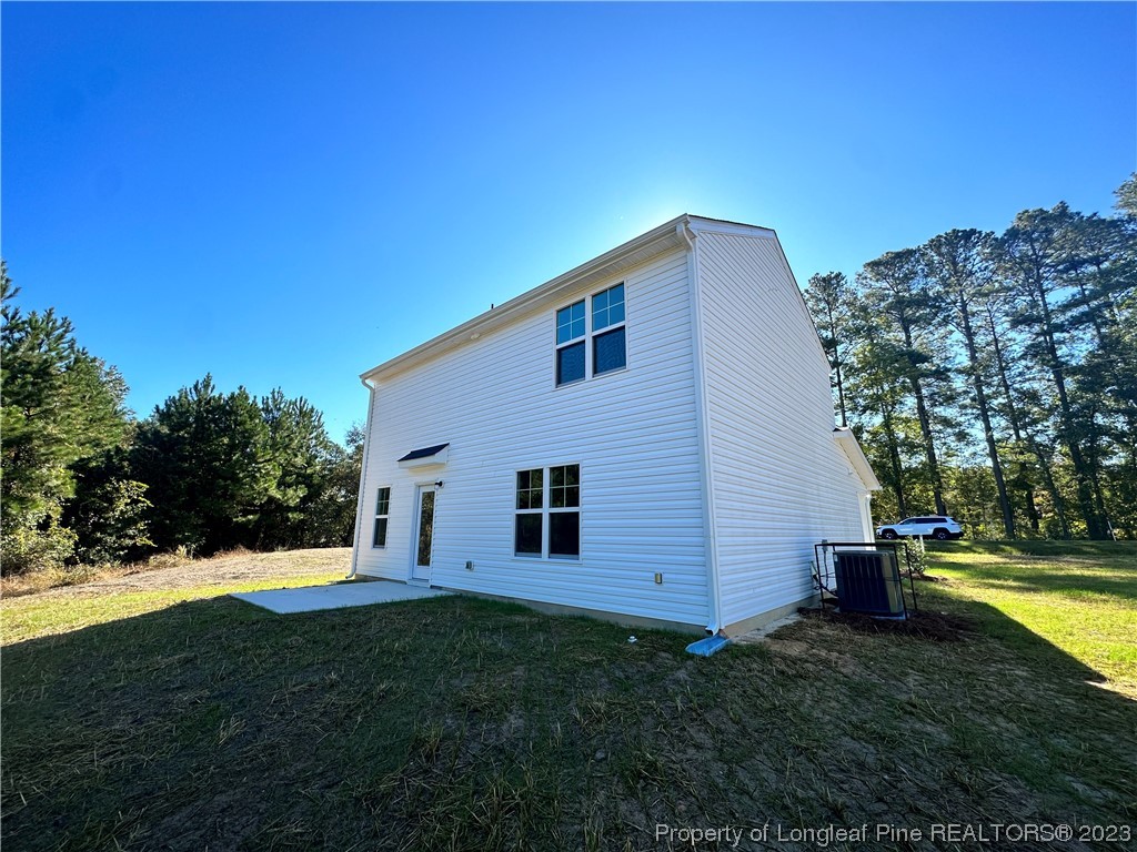757 Britt Road St. Pauls, NC 28384 - Photo 25 of 25 a view of a house with backyard and trees