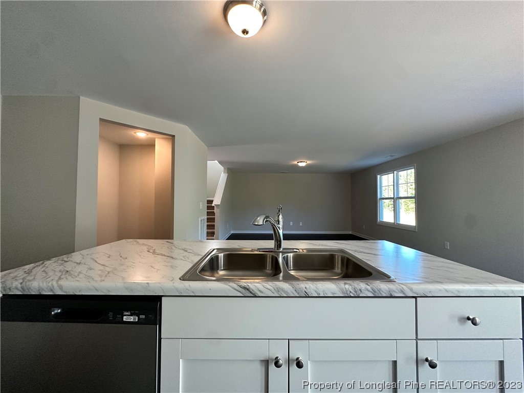 757 Britt Road St. Pauls, NC 28384 - Photo 5 of 25 a kitchen with a sink and cabinets