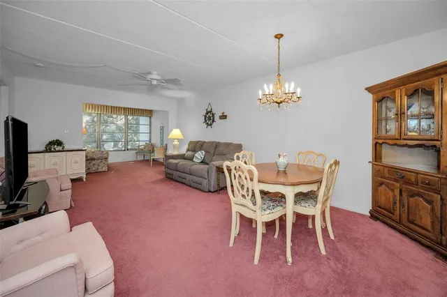 a bathroom with a sink a toilet and a window