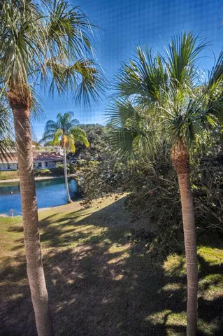 a view of a lake with a table and chairs