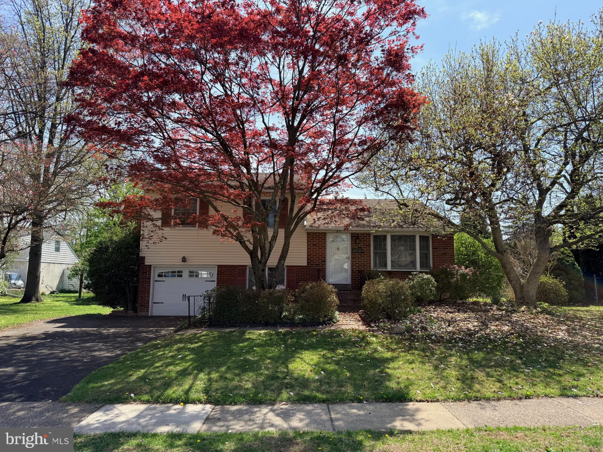 1831 Jill Road Willow Grove, PA 19090 - Photo 1 of 35 a front view of a house with garden