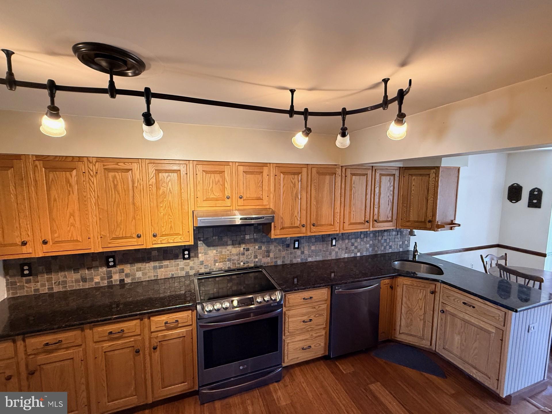 1831 Jill Road Willow Grove, PA 19090 - Photo 11 of 35 a kitchen with granite countertop a sink a counter space appliances and cabinets