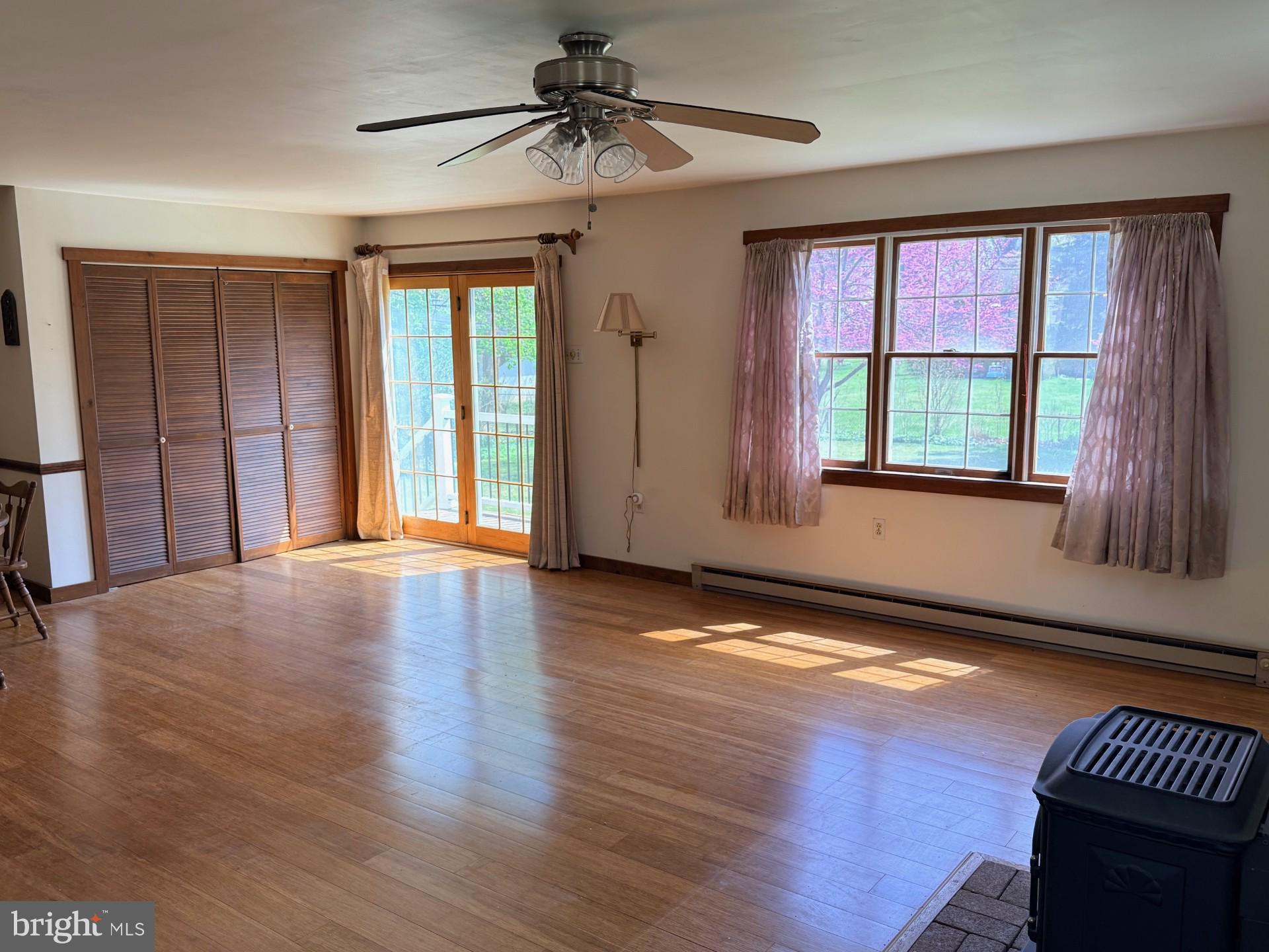 1831 Jill Road Willow Grove, PA 19090 - Photo 15 of 35 a view of an empty room with wooden floor and a window