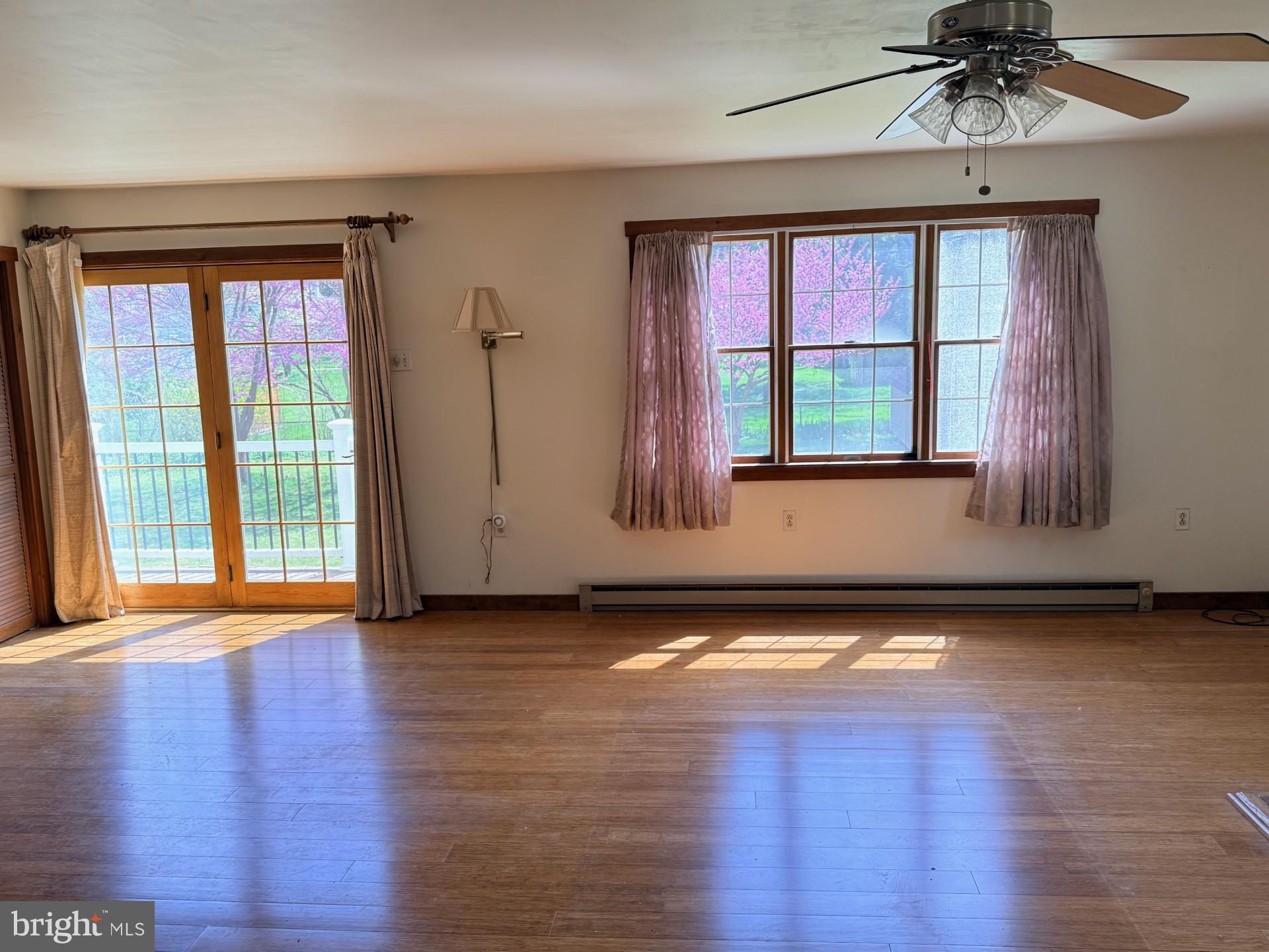 1831 Jill Road Willow Grove, PA 19090 - Photo 16 of 35 a view of an empty room with wooden floor and a window