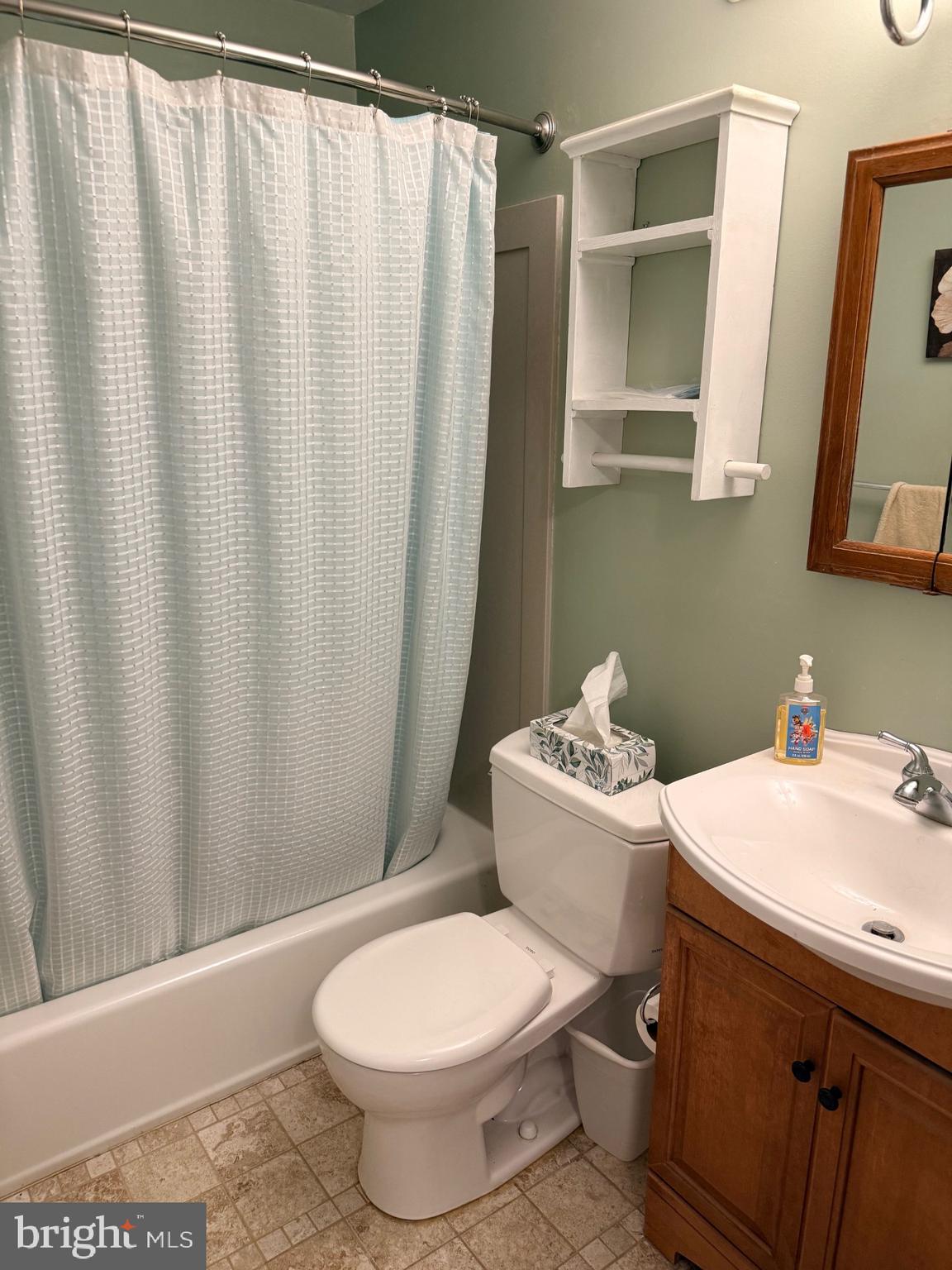 1831 Jill Road Willow Grove, PA 19090 - Photo 27 of 35 a bathroom with a sink a toilet and shower curtain