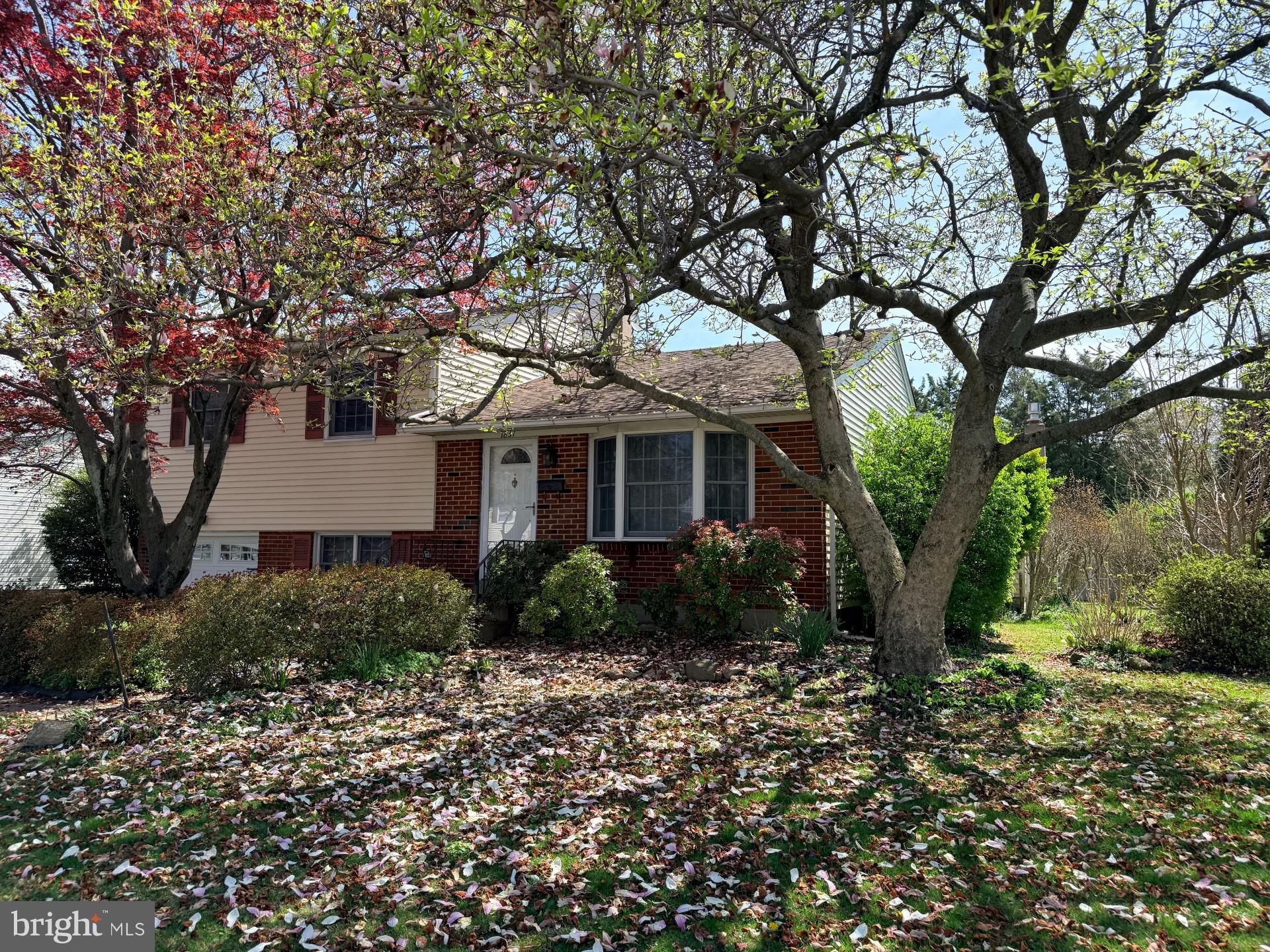 1831 Jill Road Willow Grove, PA 19090 - Photo 3 of 35 a front view of a house with garden