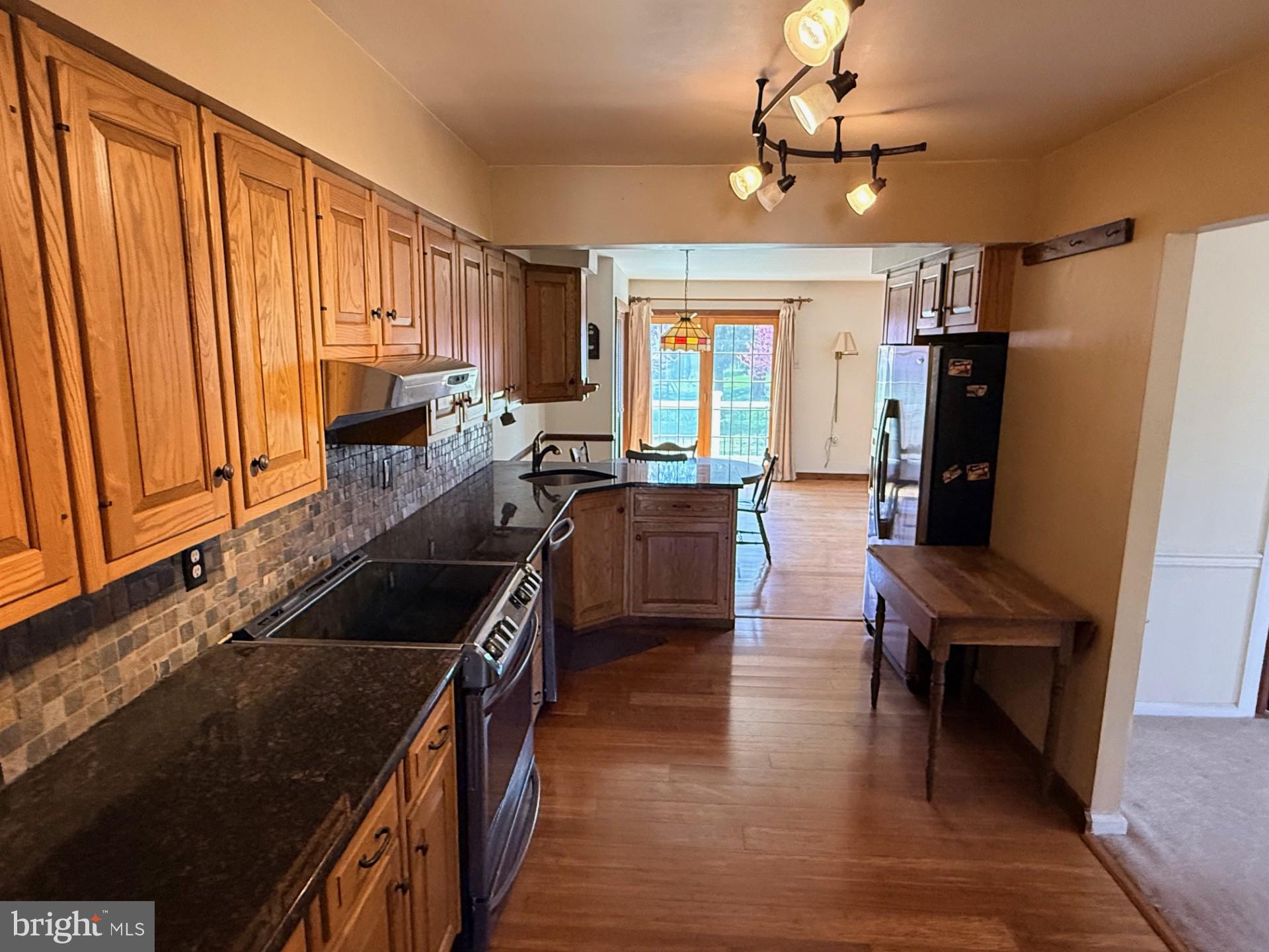 1831 Jill Road Willow Grove, PA 19090 - Photo 9 of 35 a kitchen with granite countertop a stove a sink dishwasher and a refrigerator
