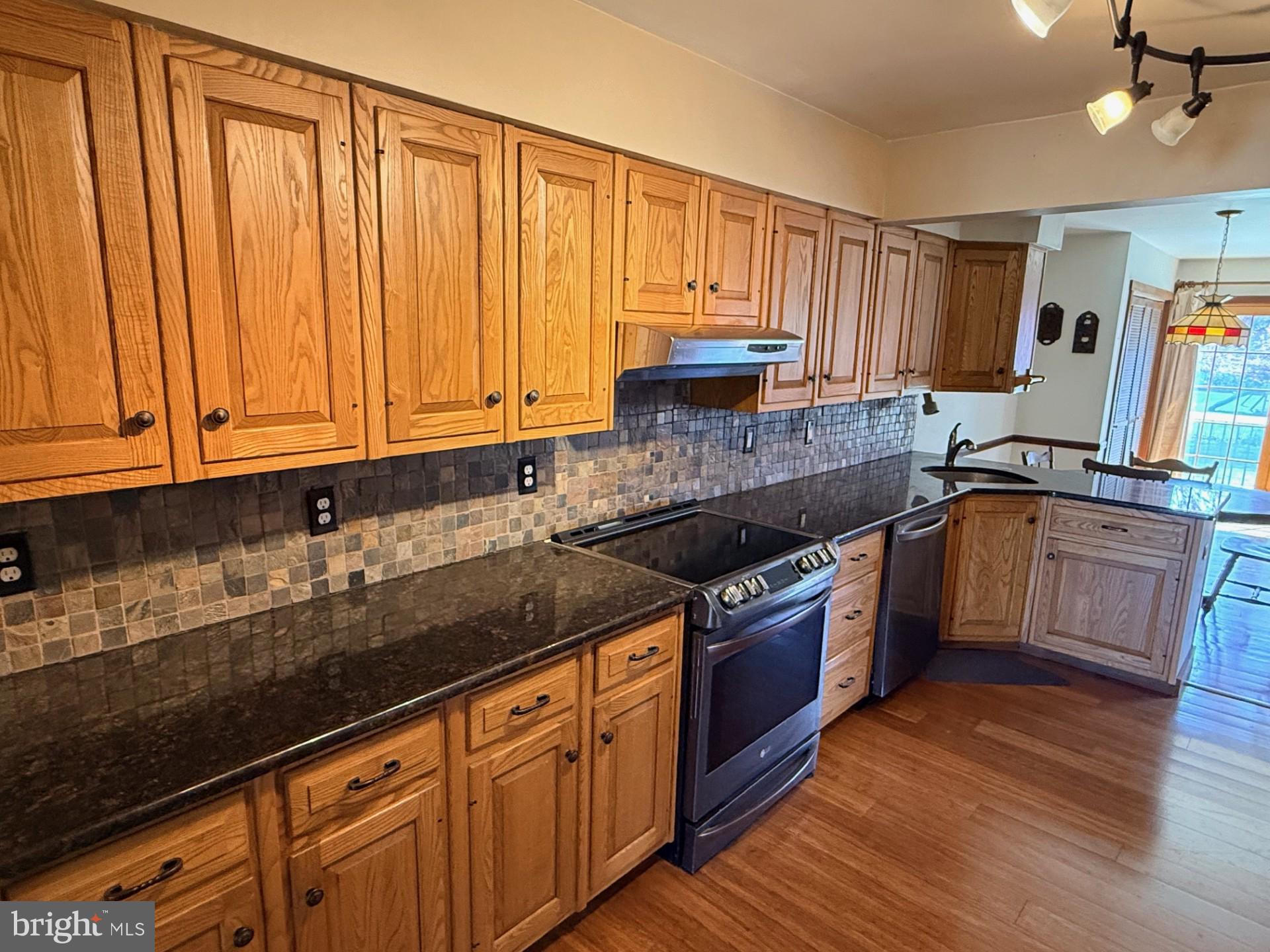 1831 Jill Road Willow Grove, PA 19090 - Photo 10 of 35 a kitchen with stainless steel appliances granite countertop wooden cabinets a sink and dishwasher