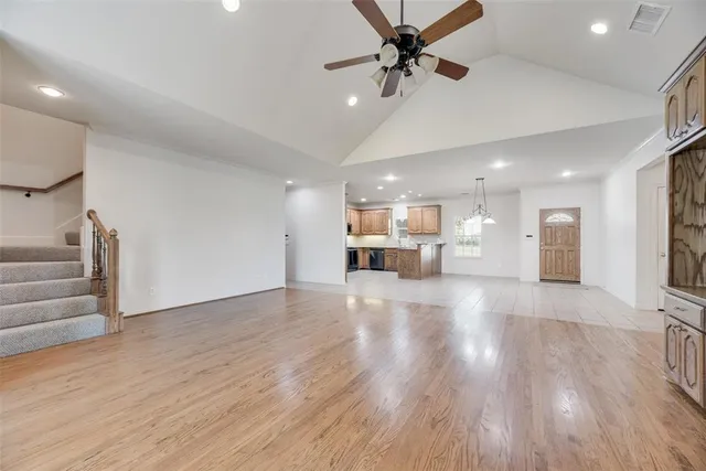 a view of kitchen with furniture and wooden floor