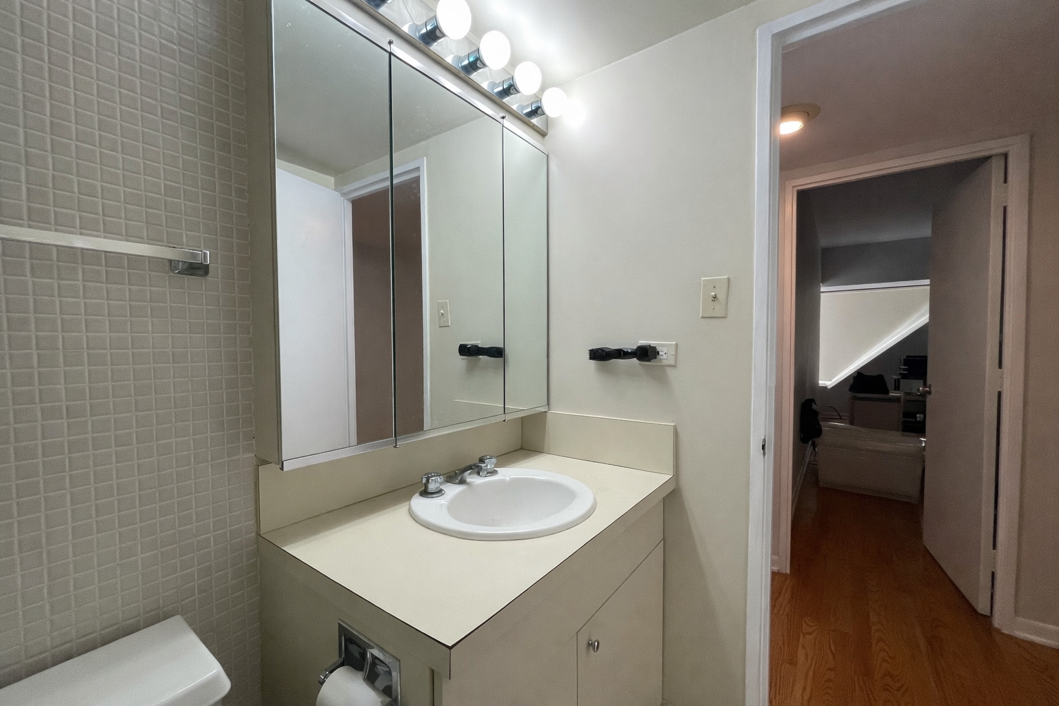 175 East Delaware Place, Unit 6114 Chicago, IL 60611 - Photo 13 of 16 a bathroom with a sink a toilet and shower