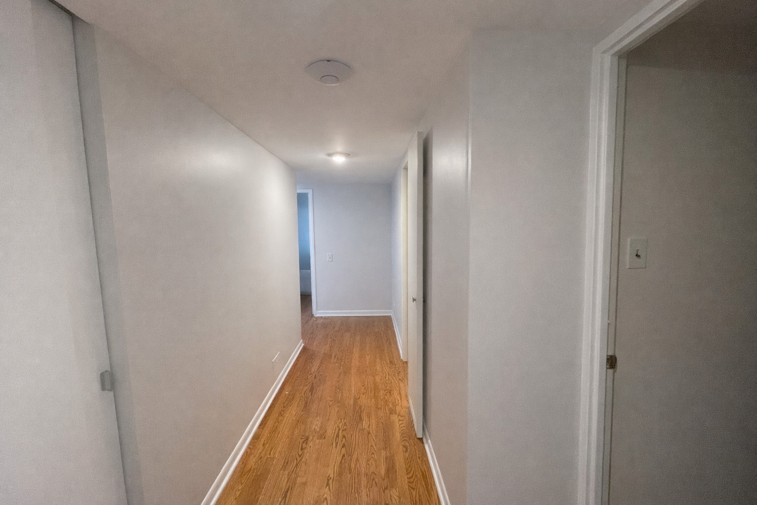 175 East Delaware Place, Unit 6114 Chicago, IL 60611 - Photo 3 of 16 a view of hallway with wooden floor