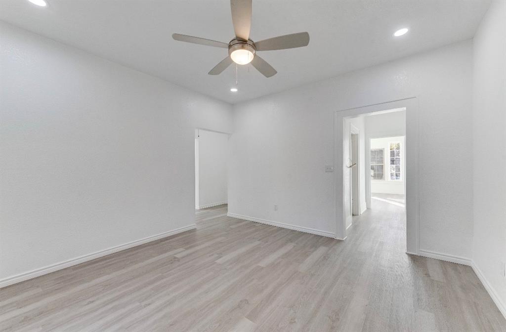 2003 Walnut Street Greenville, TX 75401 - Photo 18 of 18 wooden floor in an empty room with a window