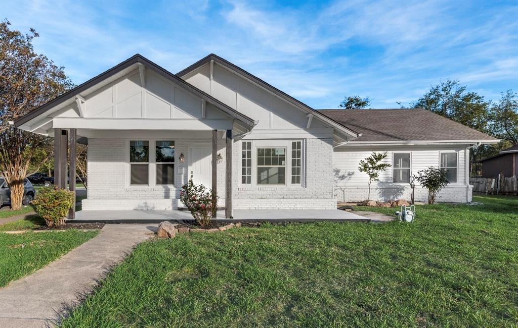 2003 Walnut Street Greenville, TX 75401 - Photo 2 of 18 a front view of a house with garden and porch