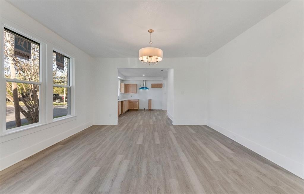 2003 Walnut Street Greenville, TX 75401 - Photo 5 of 18 a view of empty room with wooden floor and fan