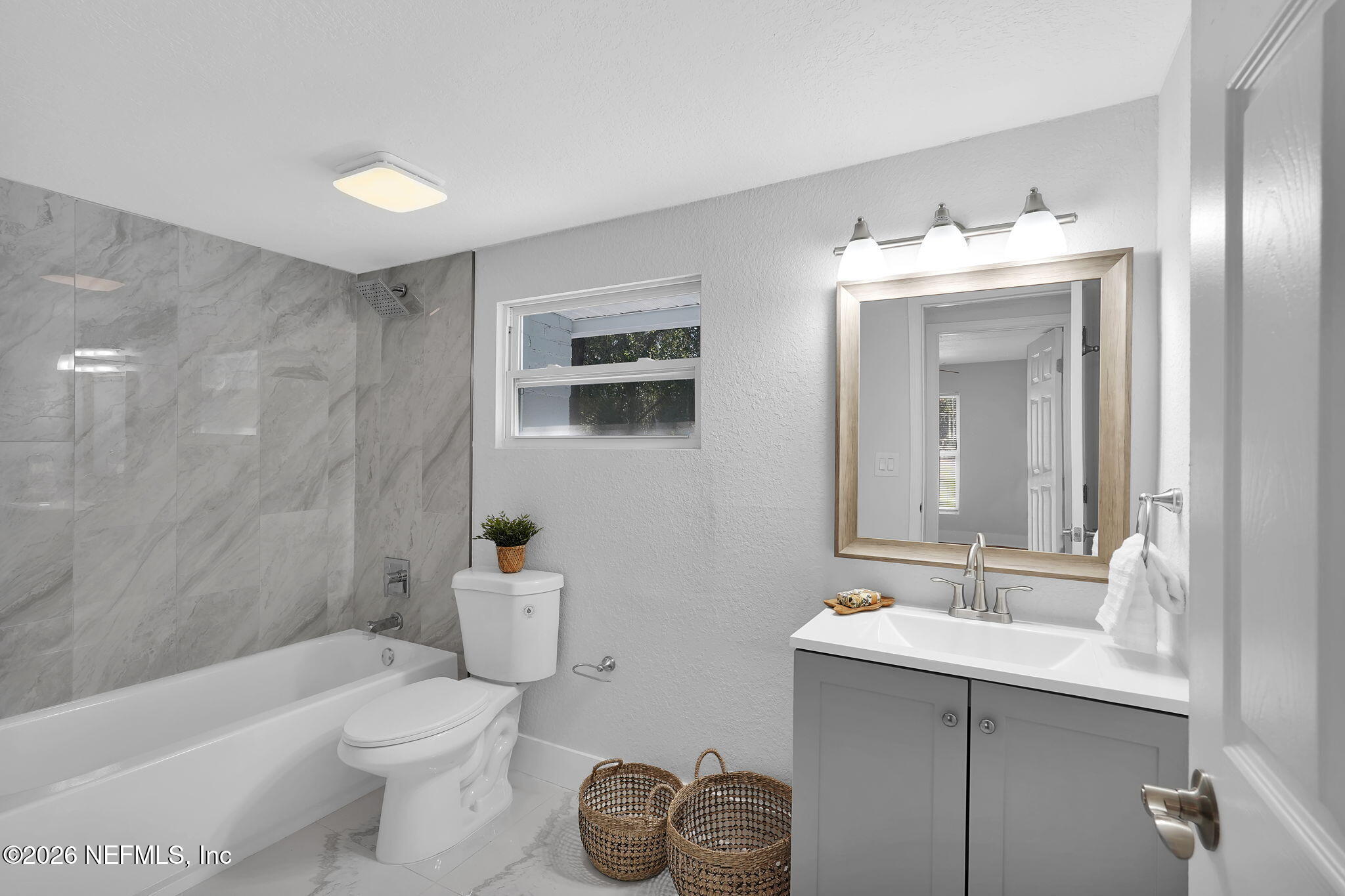 3946 Murrhee Road Green Cove Springs, FL 32043 - Photo 18 of 35 a bathroom with a sink toilet and shower