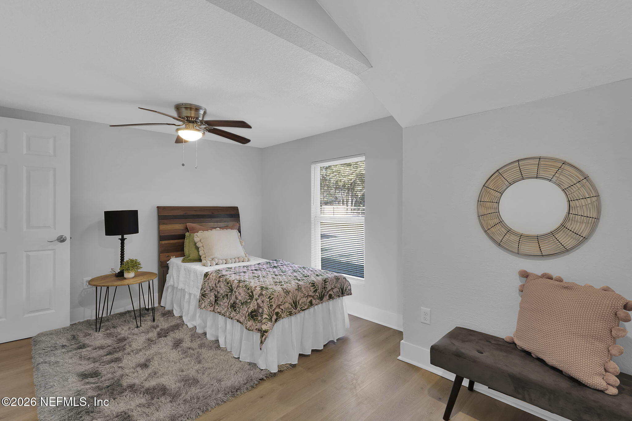 3946 Murrhee Road Green Cove Springs, FL 32043 - Photo 23 of 35 a bedroom with a bed window and a chair