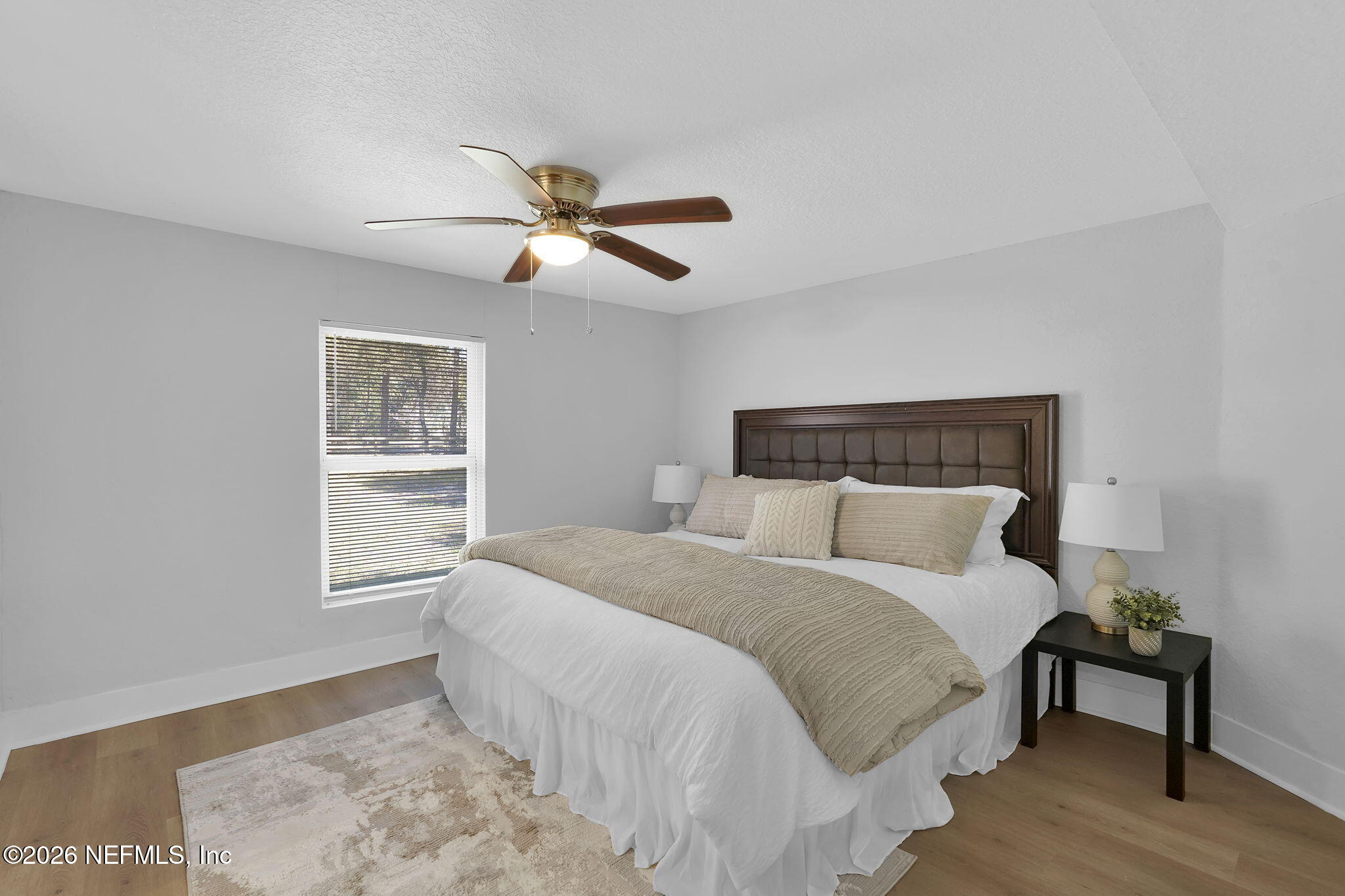 3946 Murrhee Road Green Cove Springs, FL 32043 - Photo 24 of 35 a bedroom with a large bed and a window