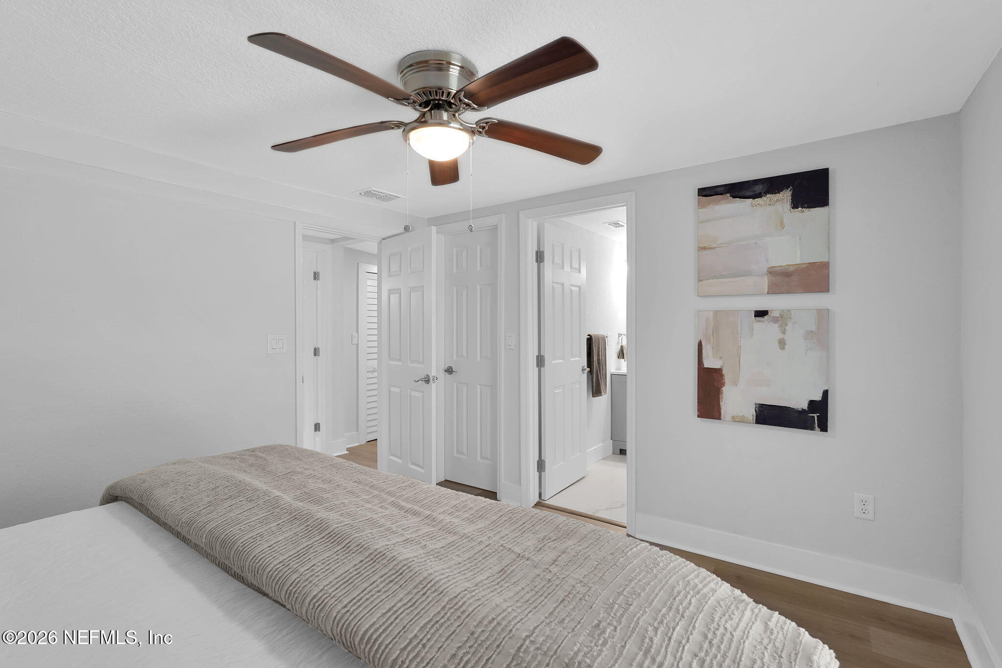 3946 Murrhee Road Green Cove Springs, FL 32043 - Photo 25 of 35 a view of a bedroom with a bed and a ceiling fan