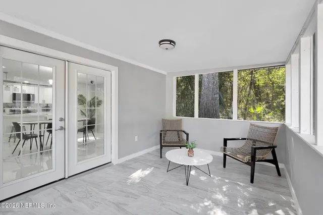 a view of a livingroom with furniture and a window