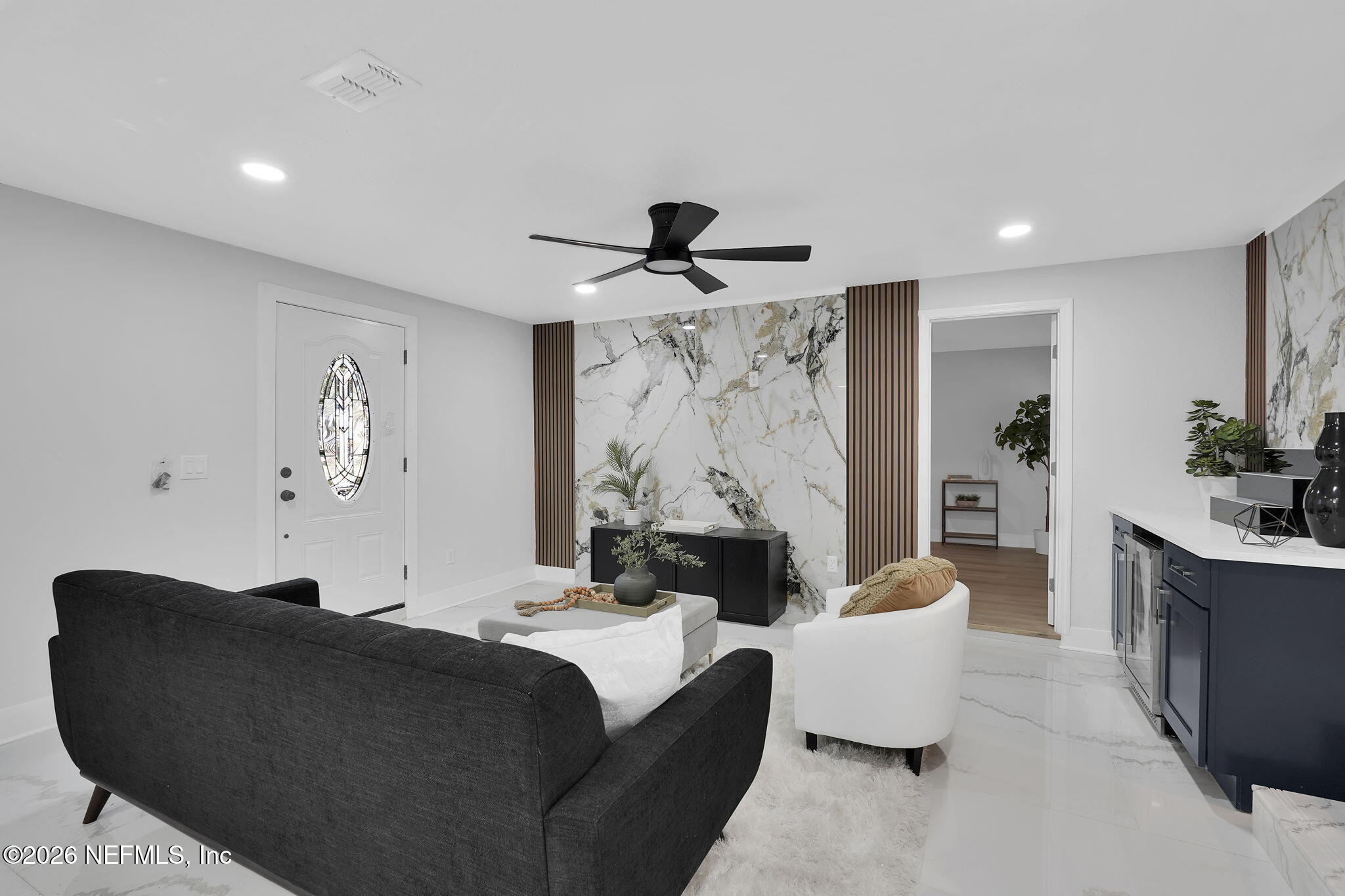 3946 Murrhee Road Green Cove Springs, FL 32043 - Photo 6 of 35 a living room with furniture and a large mirror