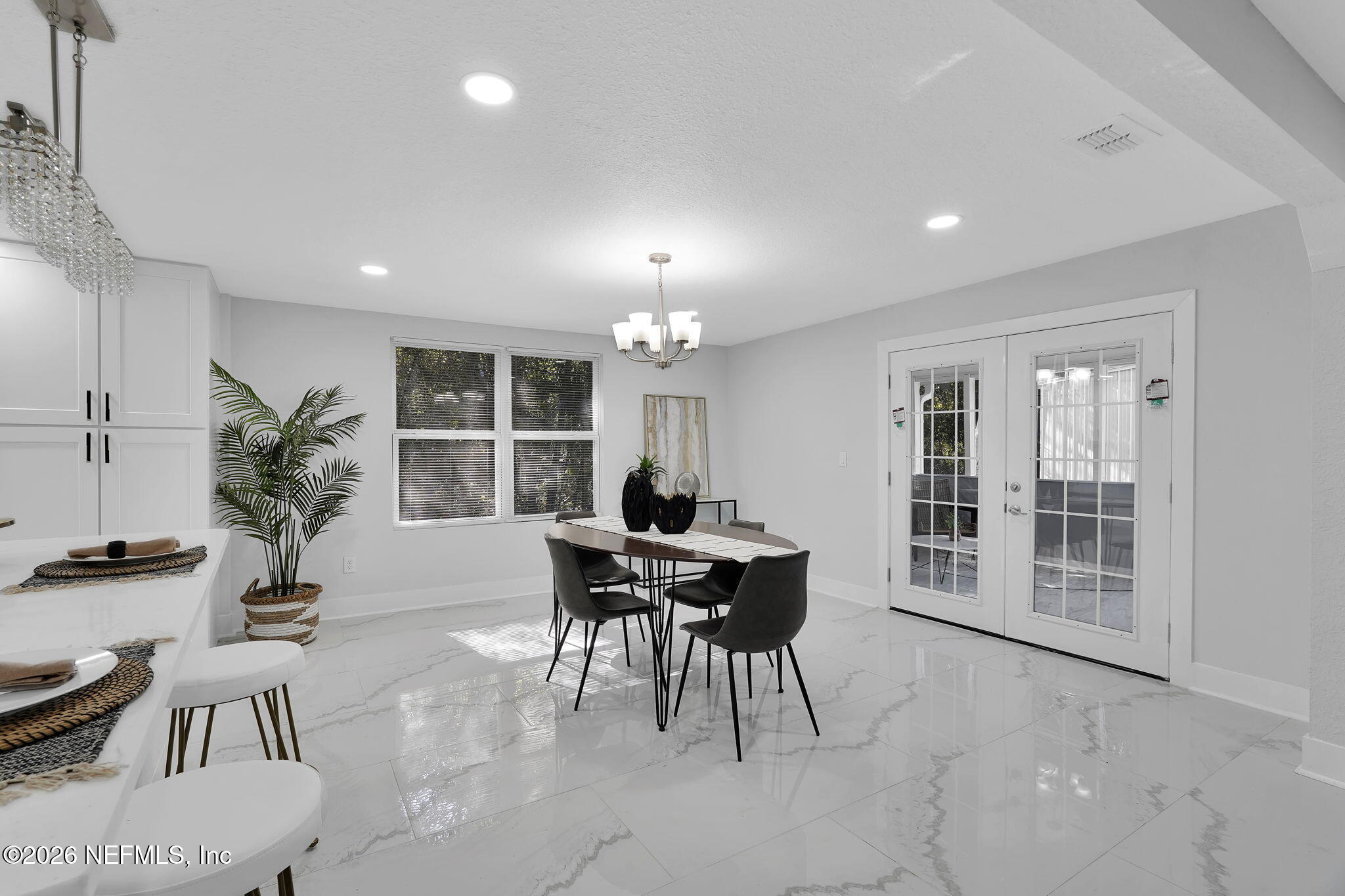 3946 Murrhee Road Green Cove Springs, FL 32043 - Photo 9 of 35 a view of a dining room with furniture window and wooden floor