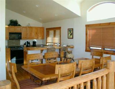 155 Knudson Ranch Road, Unit 18 Edwards, CO 81632 - Photo 3 of 8 a living room with fireplace furniture and a window