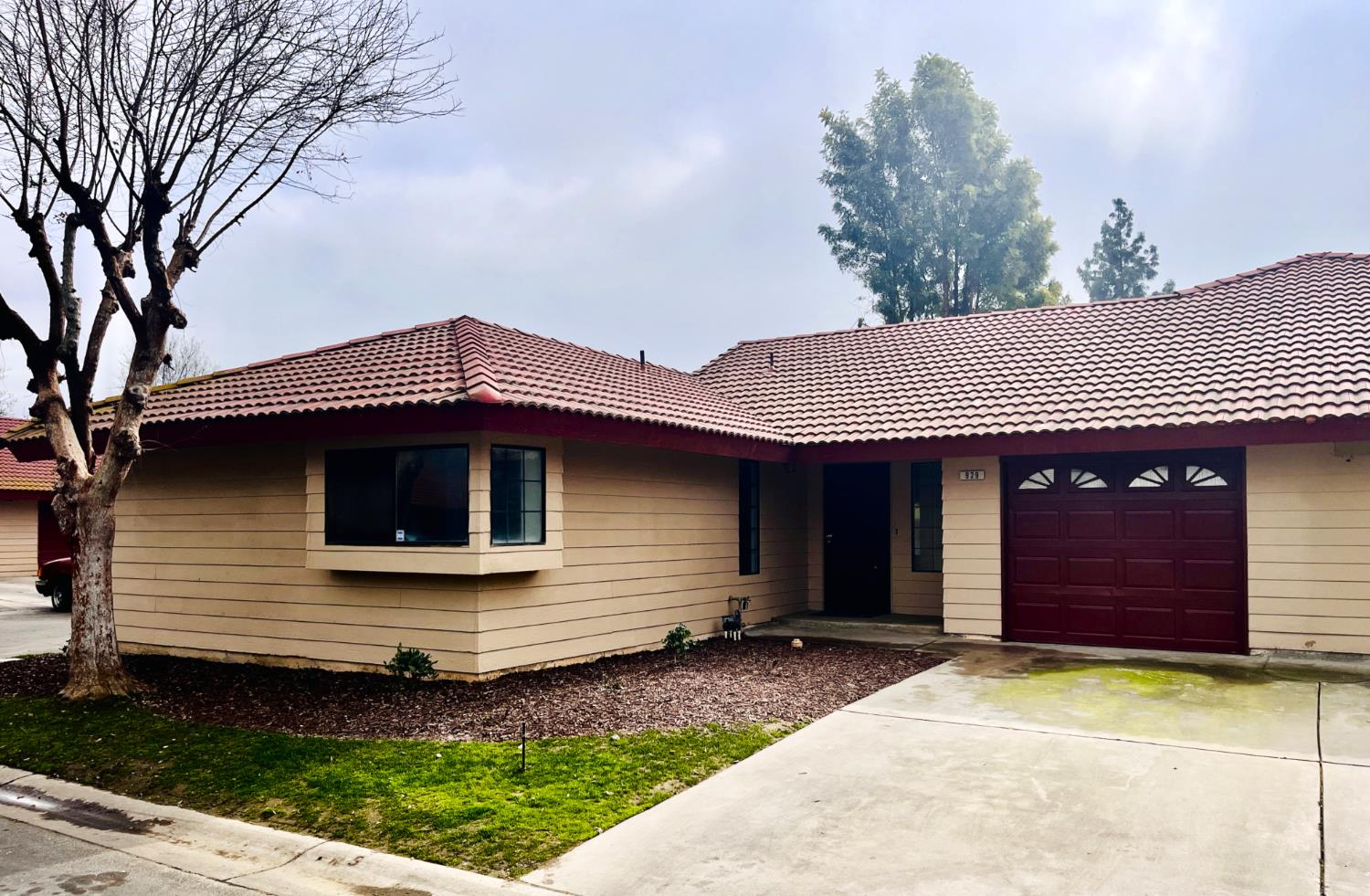 a front view of a house with garden