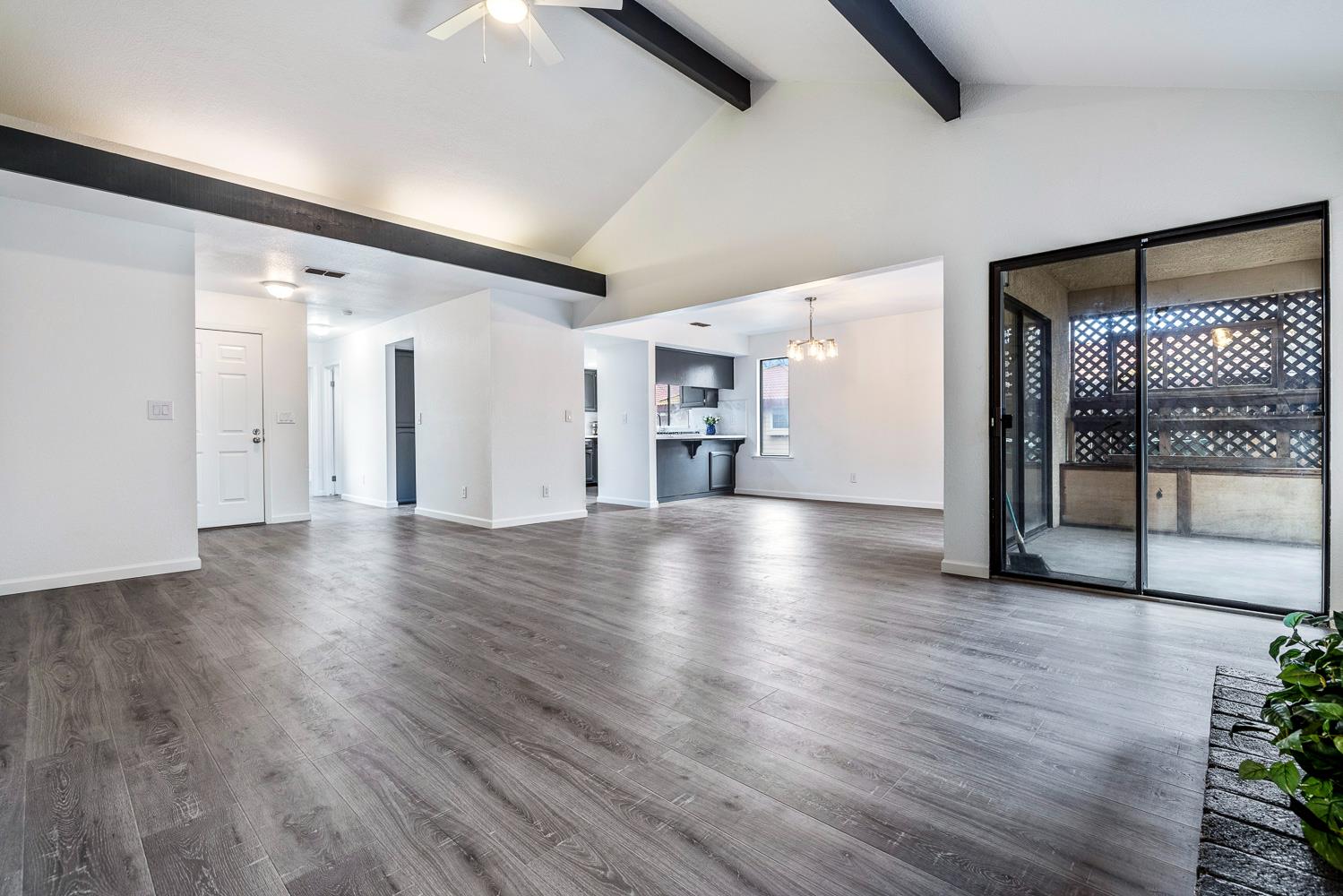 929 Barnett Way Madera, CA 93637 - Photo 3 of 23 a view of a hallway with wooden floor