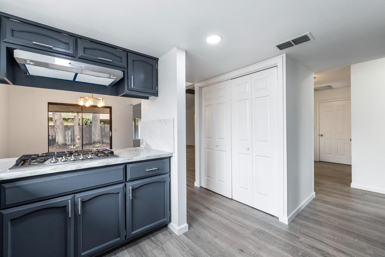 929 Barnett Way Madera, CA 93637 - Photo 9 of 23 a kitchen with stainless steel appliances a sink and cabinets