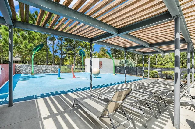 a view of swimming pool with lounge chair